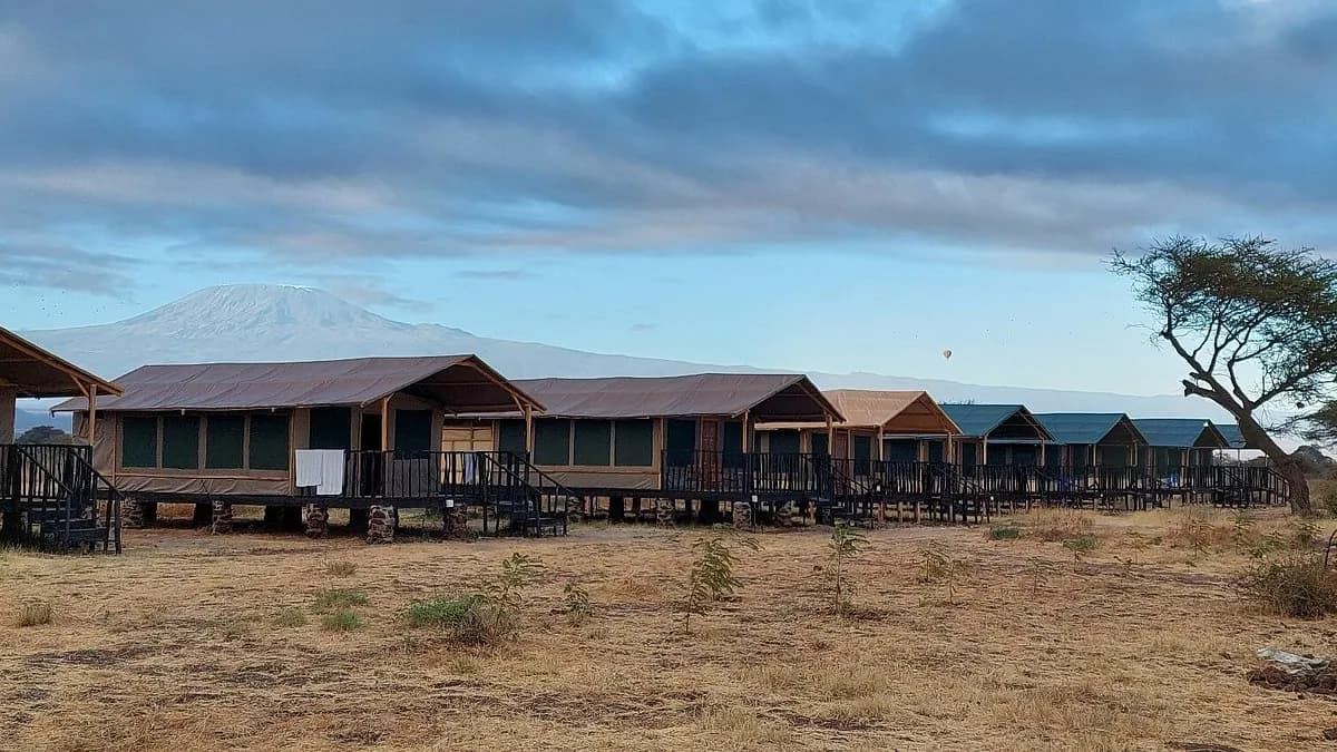 Raised cabins at Nyati Safari Camp with Kilimanjaro in the distance